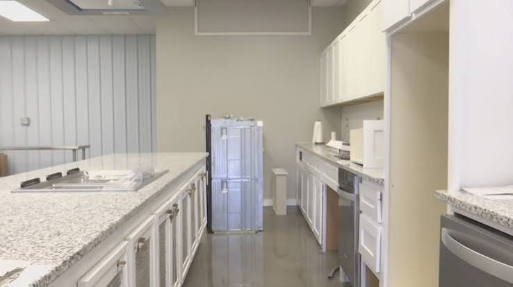 Commercial kitchen interior with counters and appliances